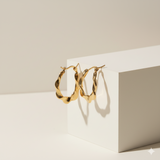 Sleek Twist Oval Hoops