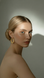 Sleek Twist Oval Hoops